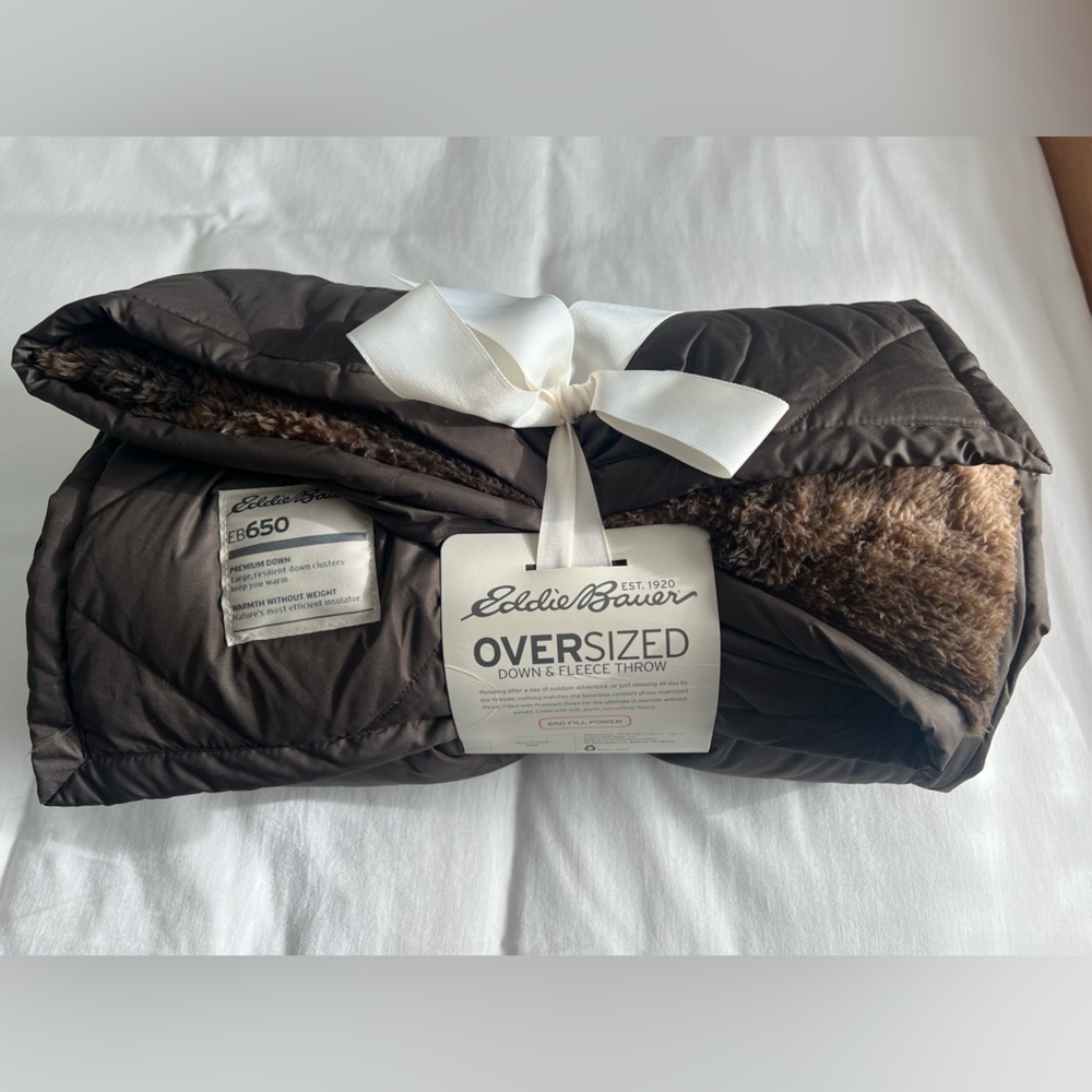 Eddie Bauer - Down & Fleece Throw Blanket.
50” x 72” in size.  New with Tags.